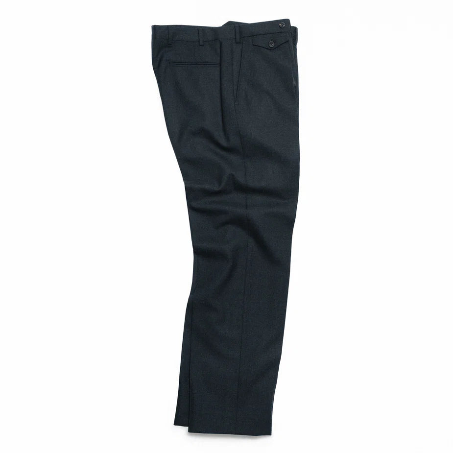 Black linen cotton trousers by J.Mueser shown from the side, featuring a relaxed fit and classic style.