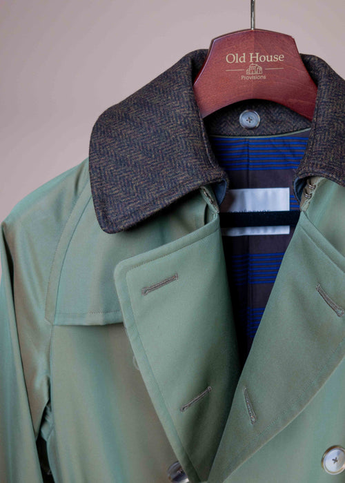 Green AL II trench coat by Cohérence displayed on a model, showing its classic design and tailored fit.