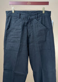 Black linen and cotton chevron Paul trousers by Cohérence, showcasing a stylish, tailored clothing design.