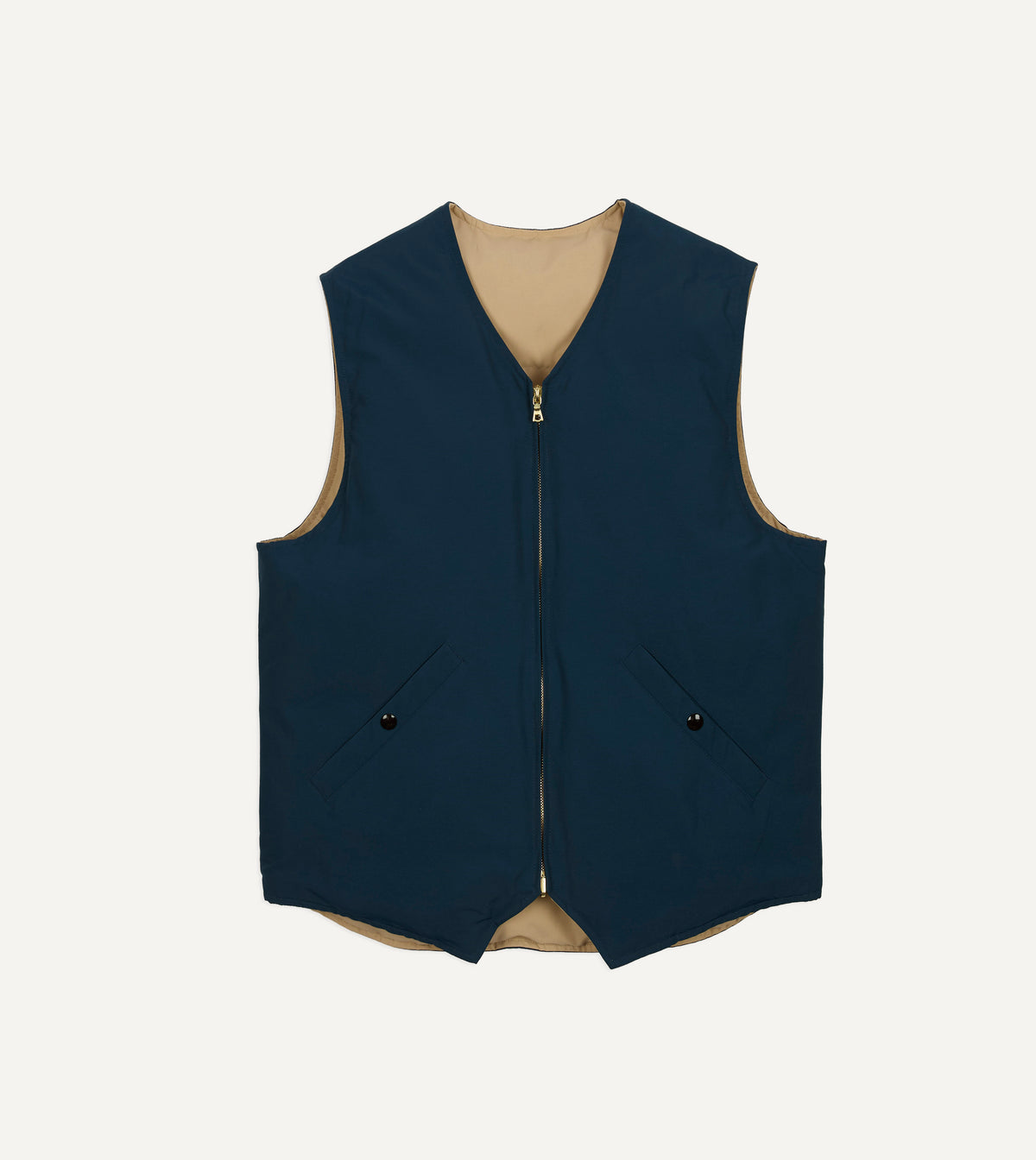 Reversible Drake's down vest in petrol and ecru, showing both sides with quilted fabric and lightweight padding.