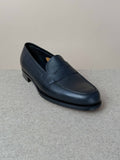 Edward Green Pimlico Penny Loafer in black Cotswold grain leather, showcasing classic slip-on footwear with sleek design.