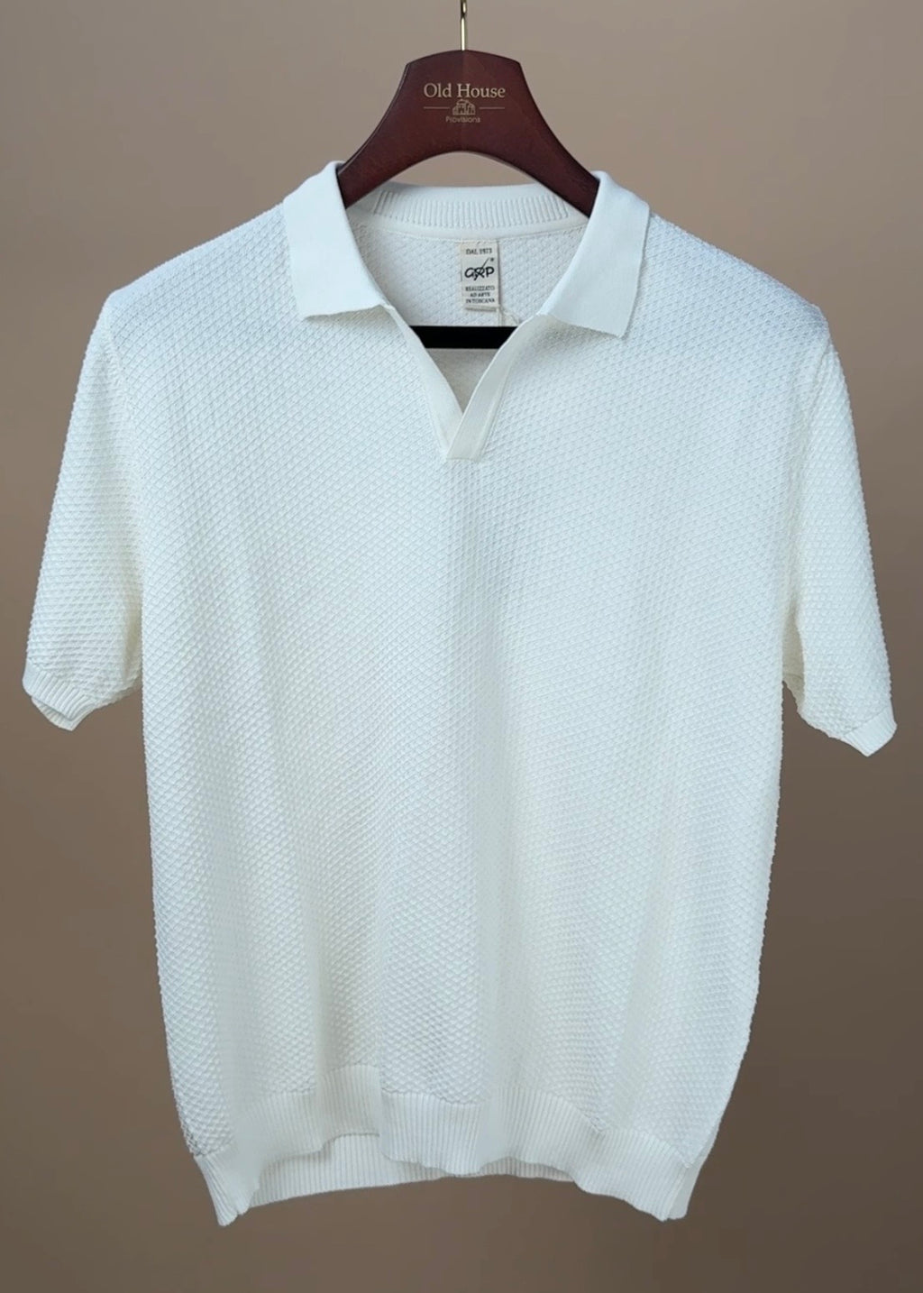 Ecru Neo Polo by GRP, men's casual clothing shirt with a classic collar and short sleeves, displayed on a hanger.