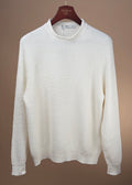 Ecru linen and cotton ribbed chevron mock neck sweater by Inis Meáin, close-up of textured fabric and mock neckline detail.