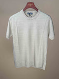 Ecru cotton flax long sleeve knitted T-shirt by J.Mueser, showing a close-up of the textured fabric and classic design.