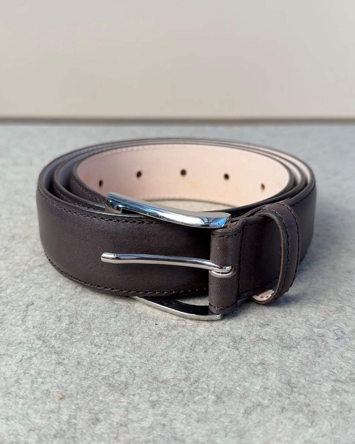 Brown calfskin belt by Kreis with a 35mm width, featuring a sleek design and polished metal buckle, ideal for accessories.