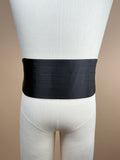 Black silk satin cummerbund from La Bowtique, a stylish accessory with smooth, shiny fabric and elegant design.