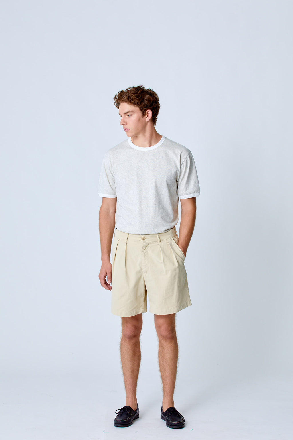 Cream Lapa Canvas Pleated Shorts by La Paz, featuring a relaxed fit and pleated design, shown on a model.