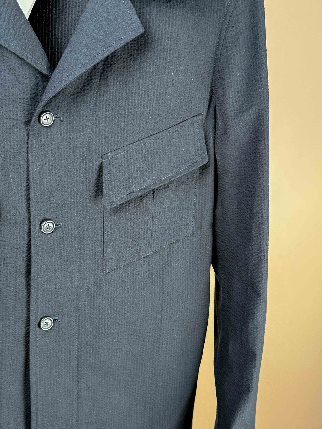 Black Seer Sucker Boutet Jacket by Lutays, showcasing a fitted, stylish black jacket with textured fabric and classic design.