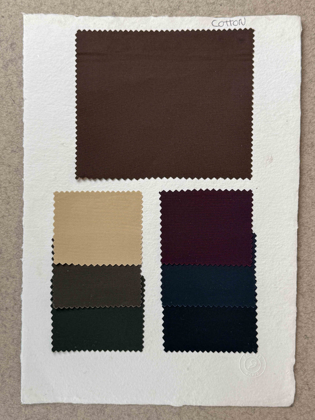 Swatches of cotton fabric for Lutays Ace Jacket MTO, showing various colors and textures for custom clothing options.