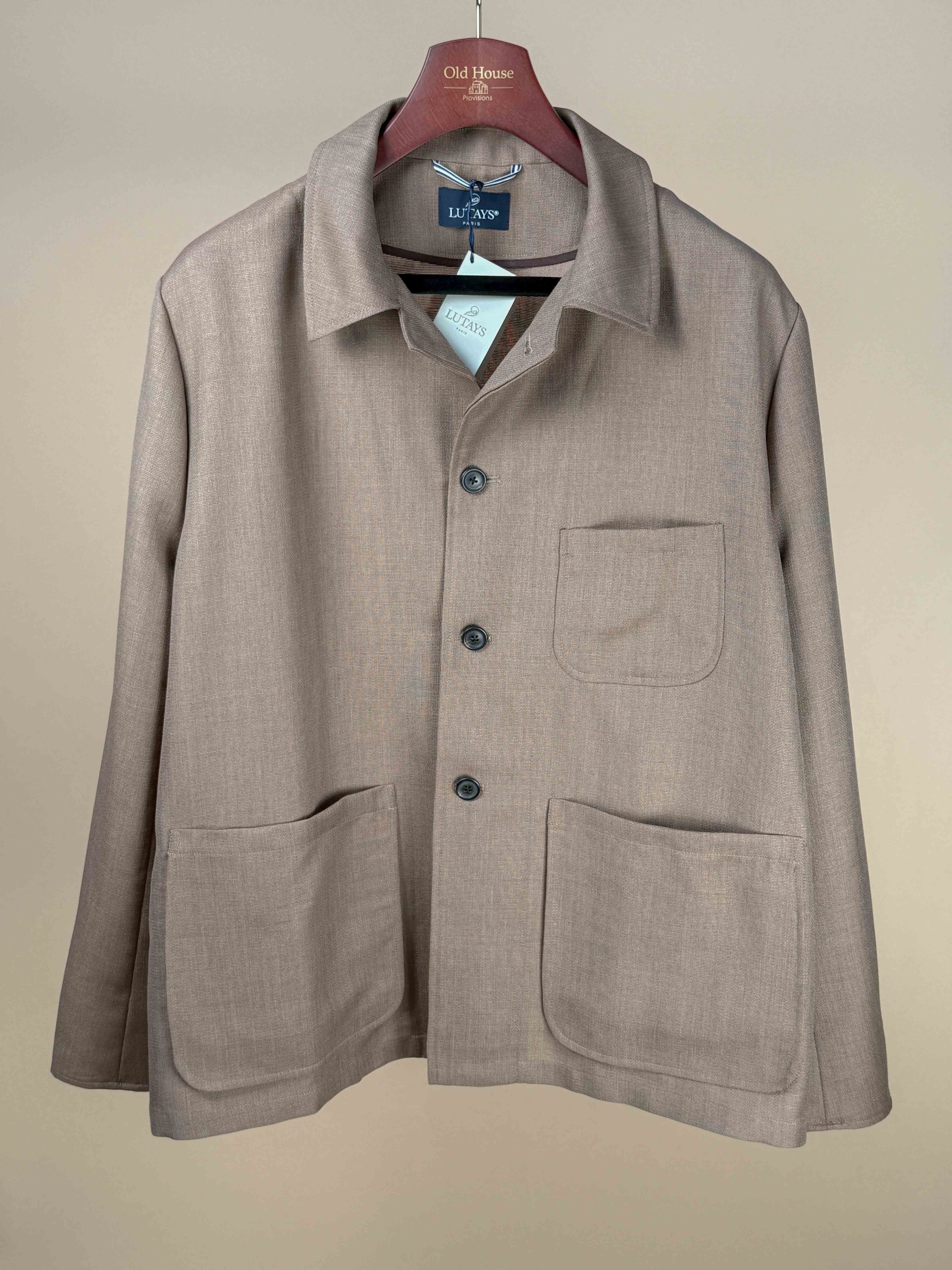 Lutays Zola beige wool mohair hopsack unlined jacket displayed on a hanger, showcasing its tailored fit and textured fabric.