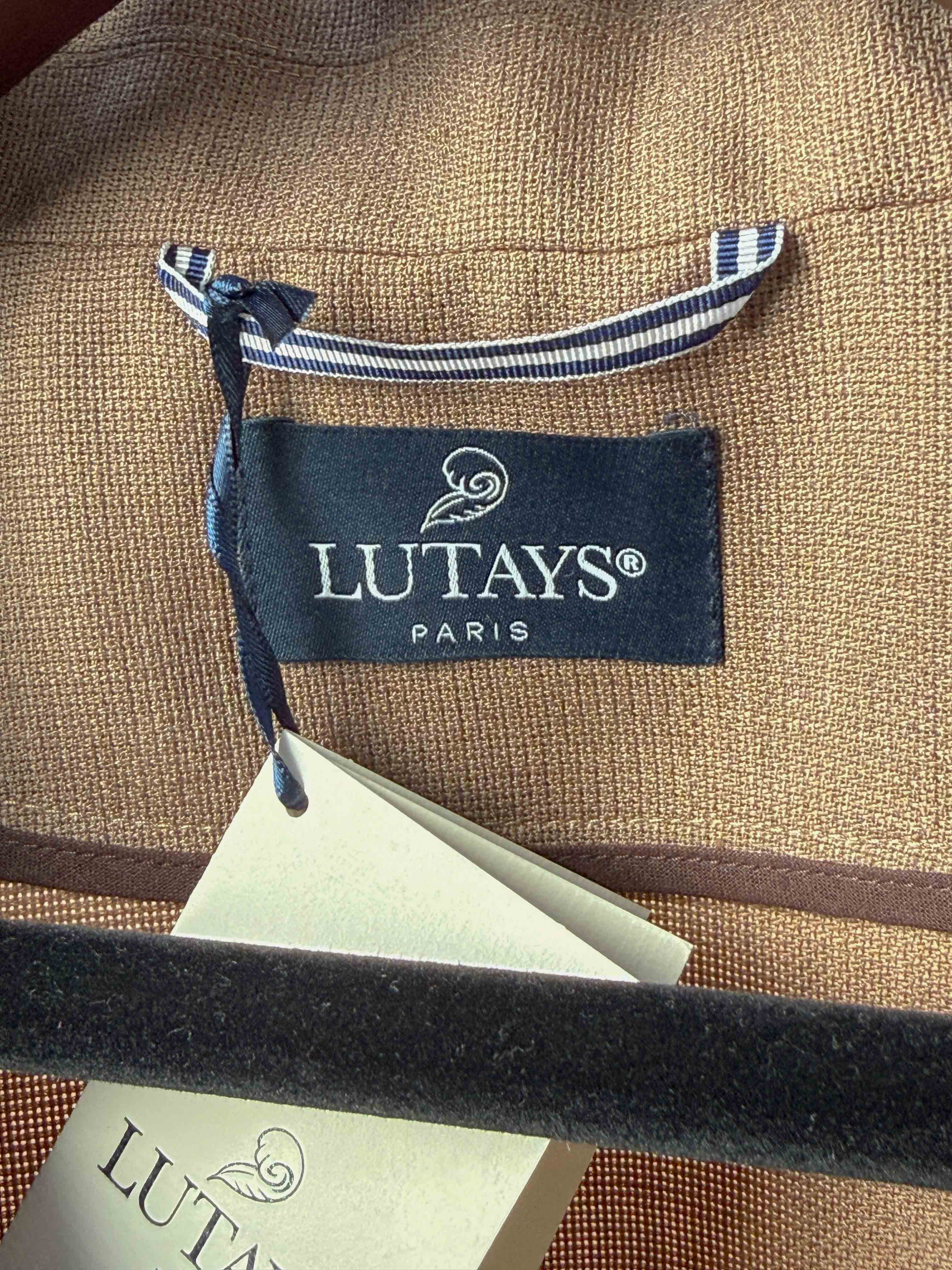Lutays Zola beige wool mohair hopsack unlined jacket displayed on a hanger, showcasing its tailored fit and textured fabric.