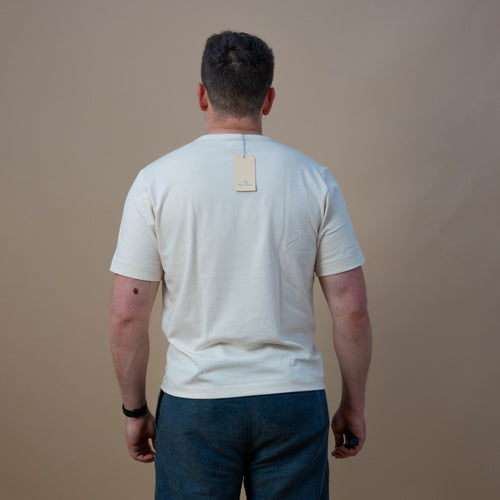 Natural-colored Merz b Schwanen 2M15C T-Shirt made of soft cotton fabric, displayed flat with neckline and sleeves visible.