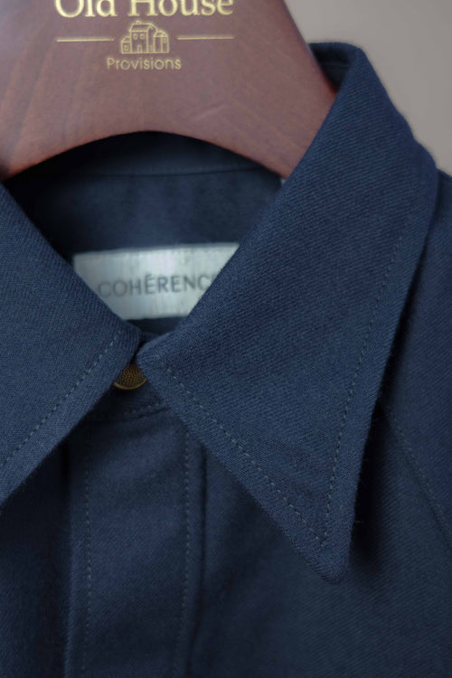 Dark blue Cohérence ABIQUIU Western Shirt with Rover wool twill fabric, shown on a hanger. Classic Western style clothing.