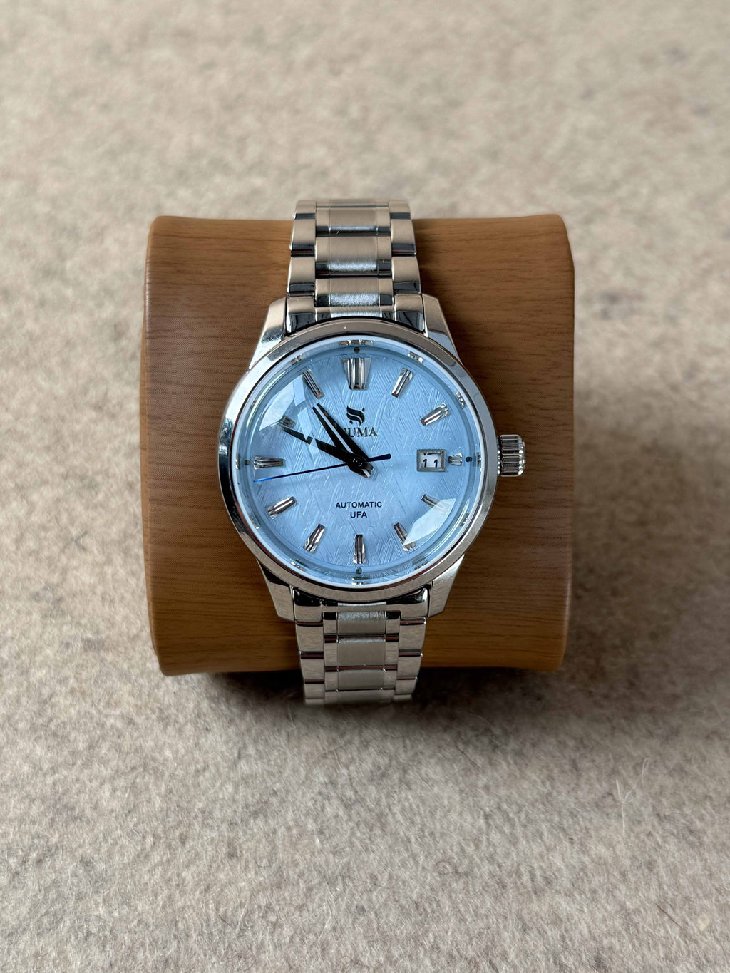 NUMA Living Waters Watch, a stylish accessory with a sleek design, featuring a round dial and durable strap.