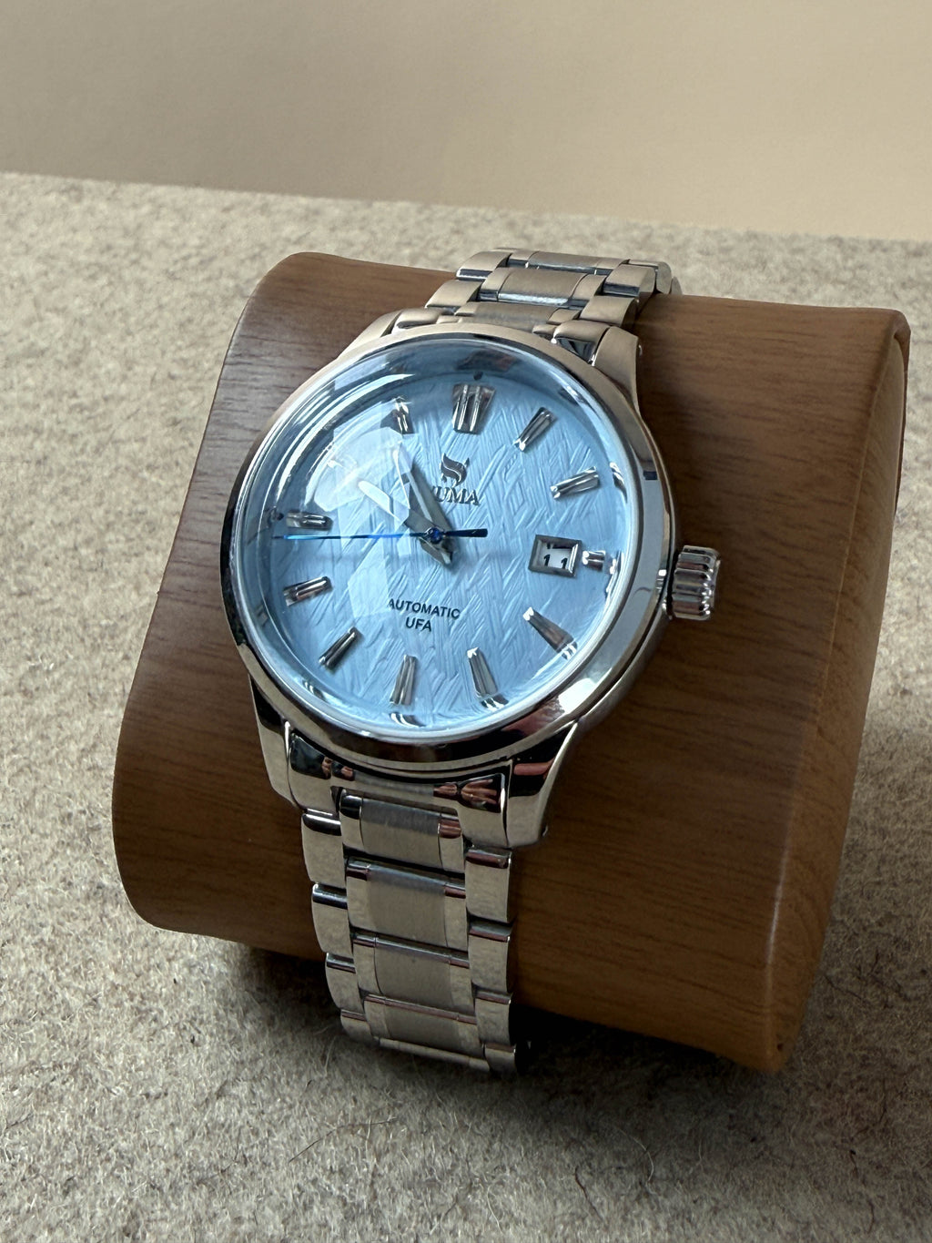 NUMA Living Waters watch with a sleek design, featuring a round dial and stylish strap, as an accessory for everyday wear.