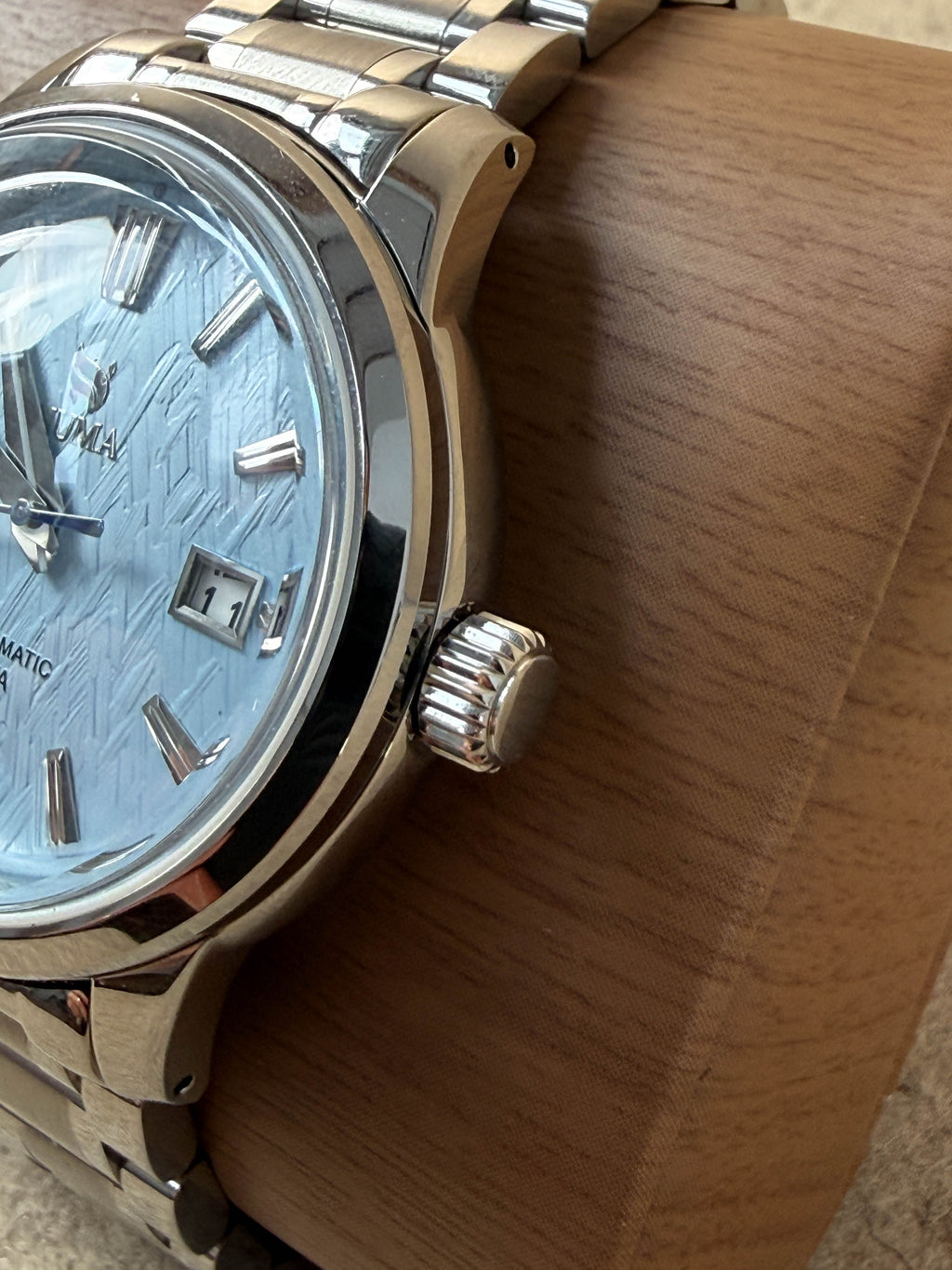 NUMA Living Waters Watch showing a sleek design with a black strap and round dial, ideal as a stylish accessories piece.