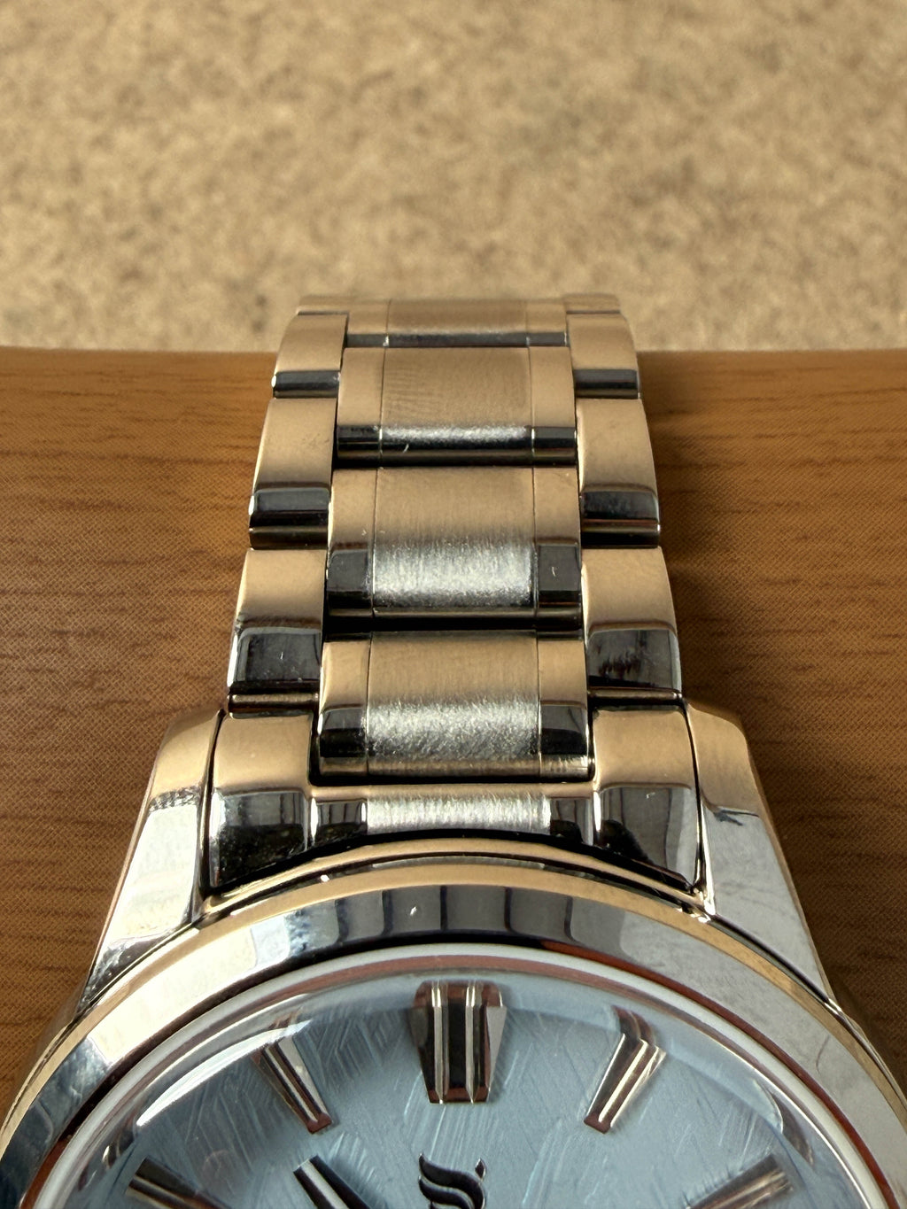 NUMA Living Waters Watch, a stylish accessory with a sleek design, featuring a round dial and durable strap.