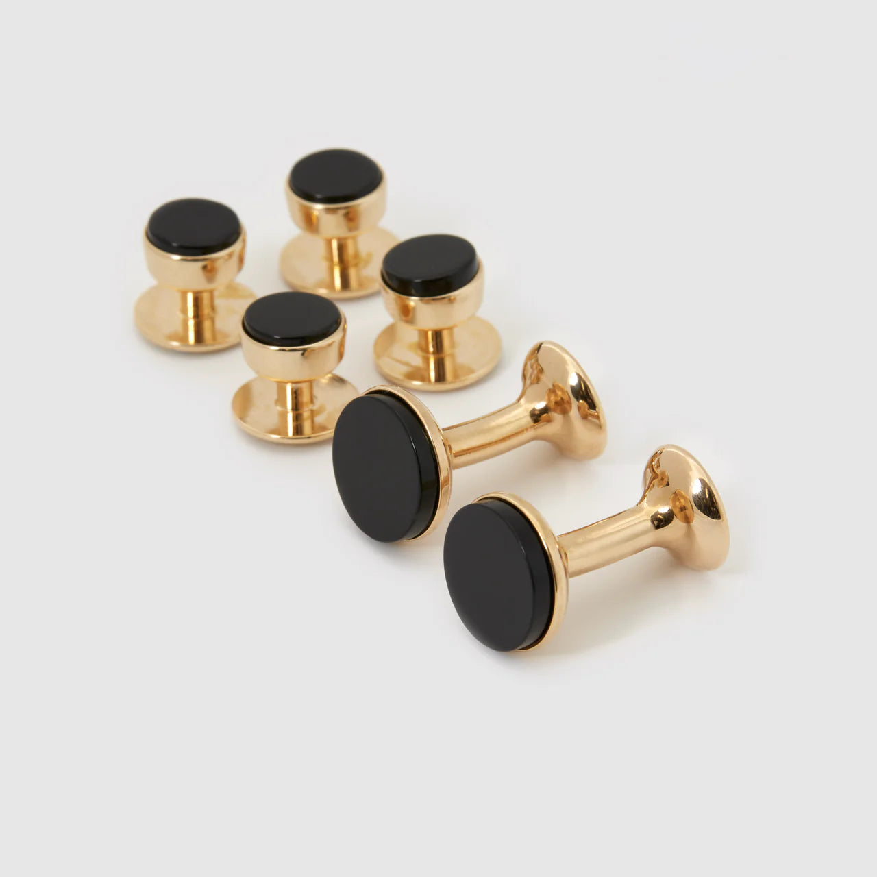 Gold and onyx bow stud earrings from Codis Maya accessories set, featuring elegant black onyx stones with gold accents.