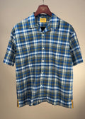 Blue and tan check Cuban short sleeve shirt by Original Madras Trading Co. displayed on a hanger.