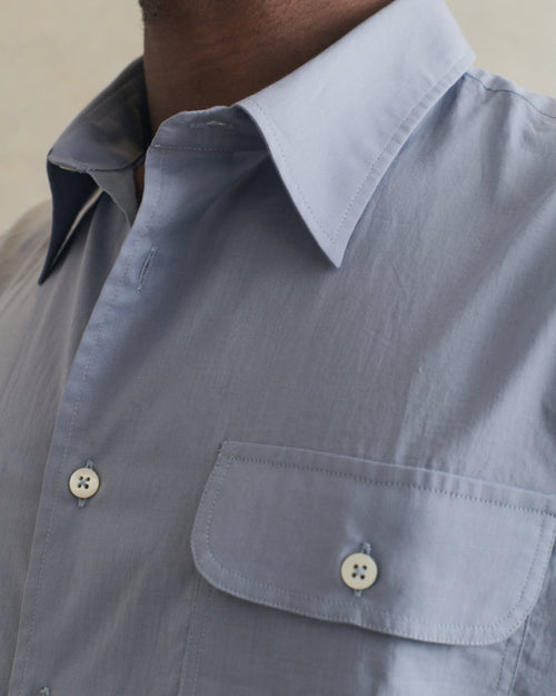 De Bonne Facture Artist Shirt in washed blue cotton voile, showcasing the relaxed fit and soft, textured fabric.