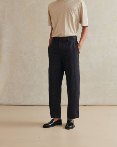 De Bonne Facture Indigo Blue Linen Denim Balloon Trousers, relaxed fit and stylish, displayed on a hanger.
