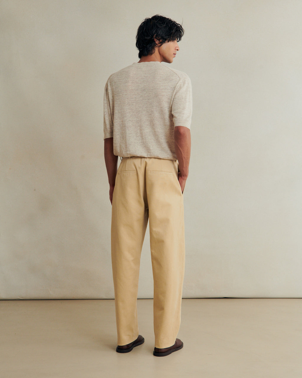 De Bonne Facture balloon trousers in heavy cotton drill with a butter color, showcasing relaxed fit and durable fabric.
