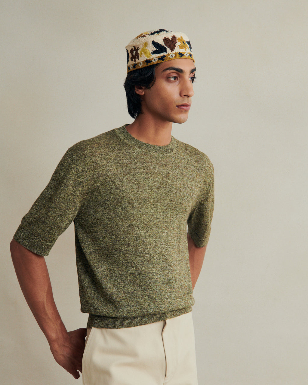 Green linen knitted tee from De Bonne Facture, featuring a relaxed fit and textured knit fabric for casual style.