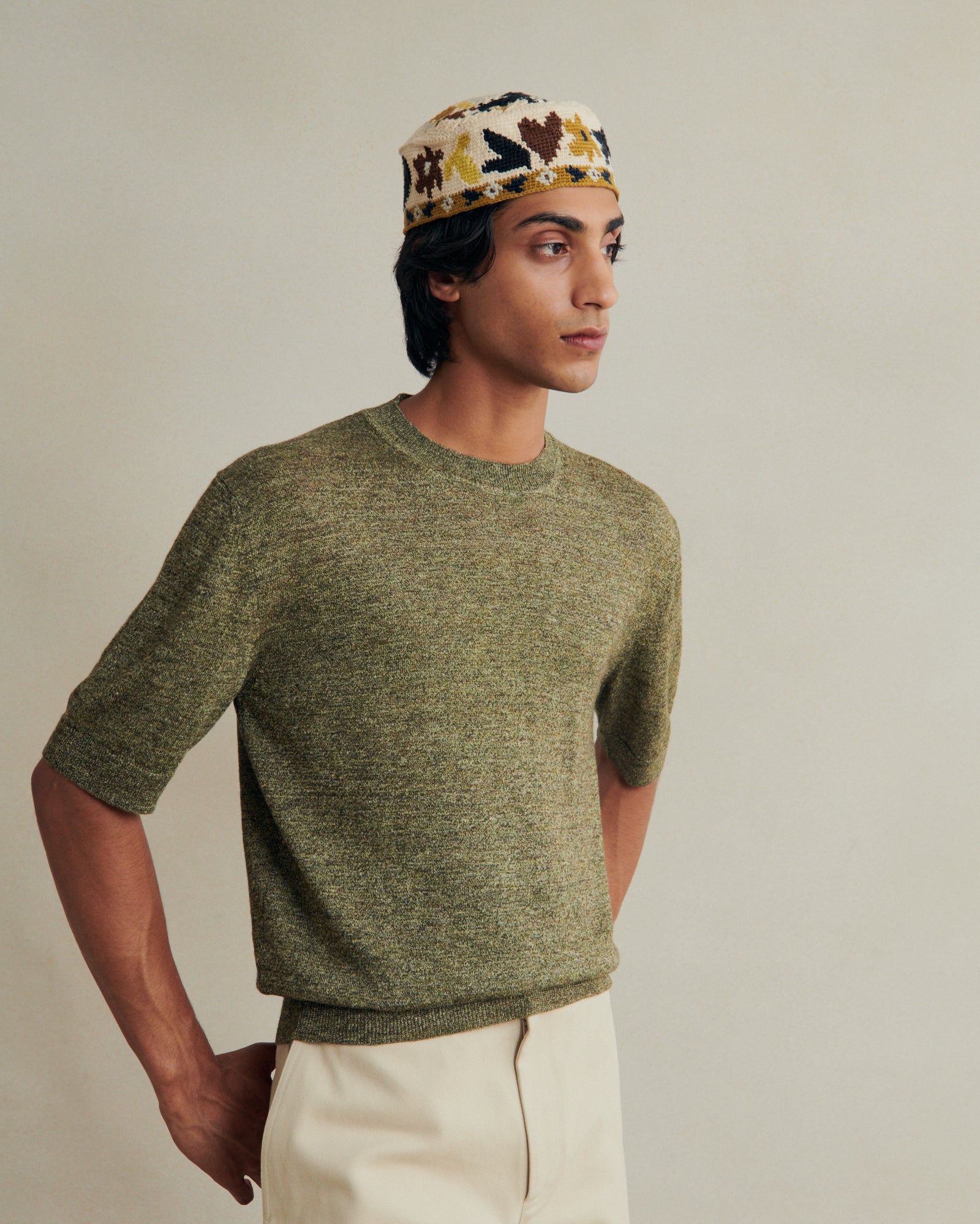 Green linen knitted tee from De Bonne Facture, featuring a relaxed fit and textured knit fabric for casual style.