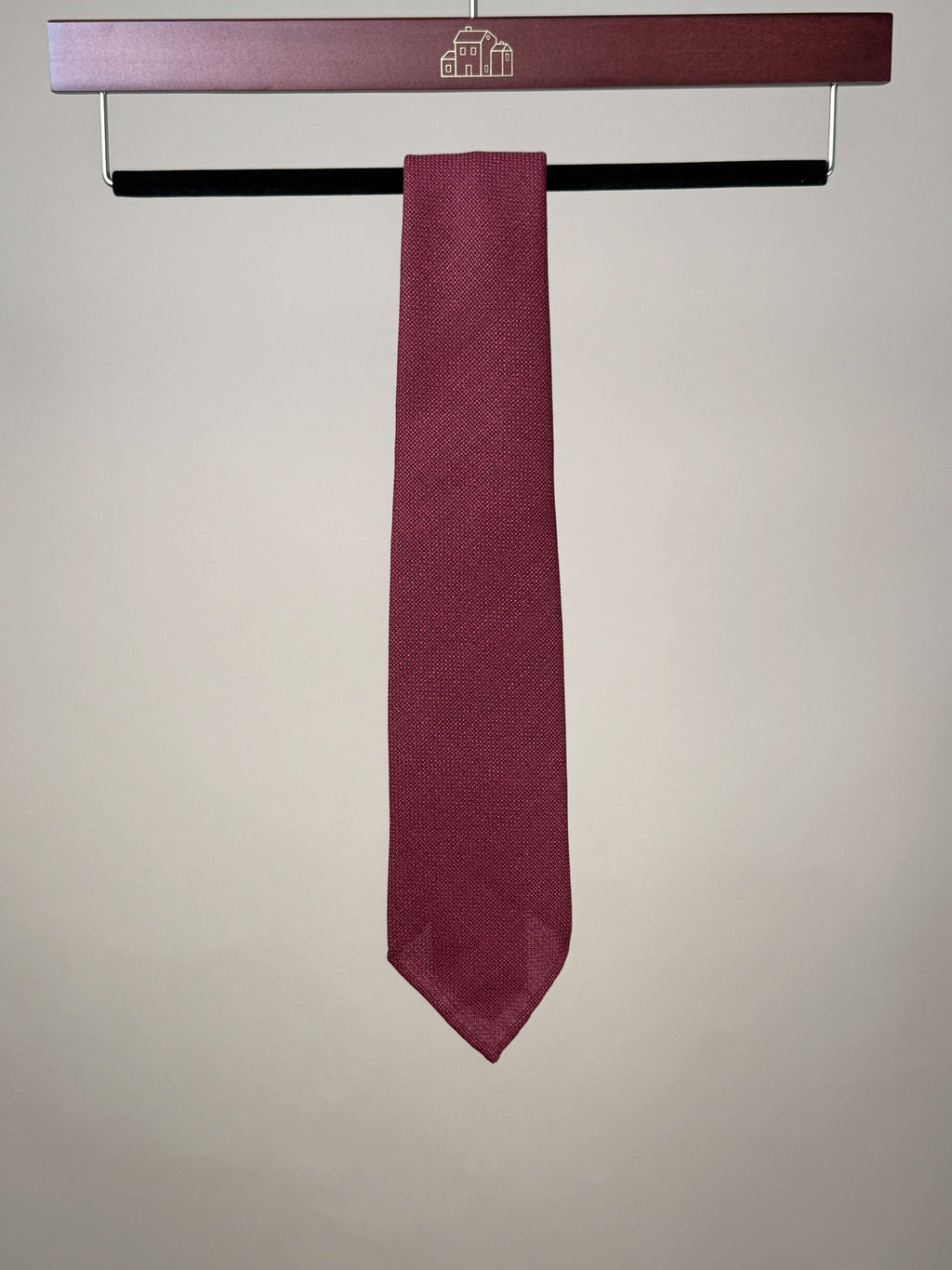 Red silk hopsack untipped tie by Paolo Albizzati, showing its textured fabric and classic design in a close-up shot.