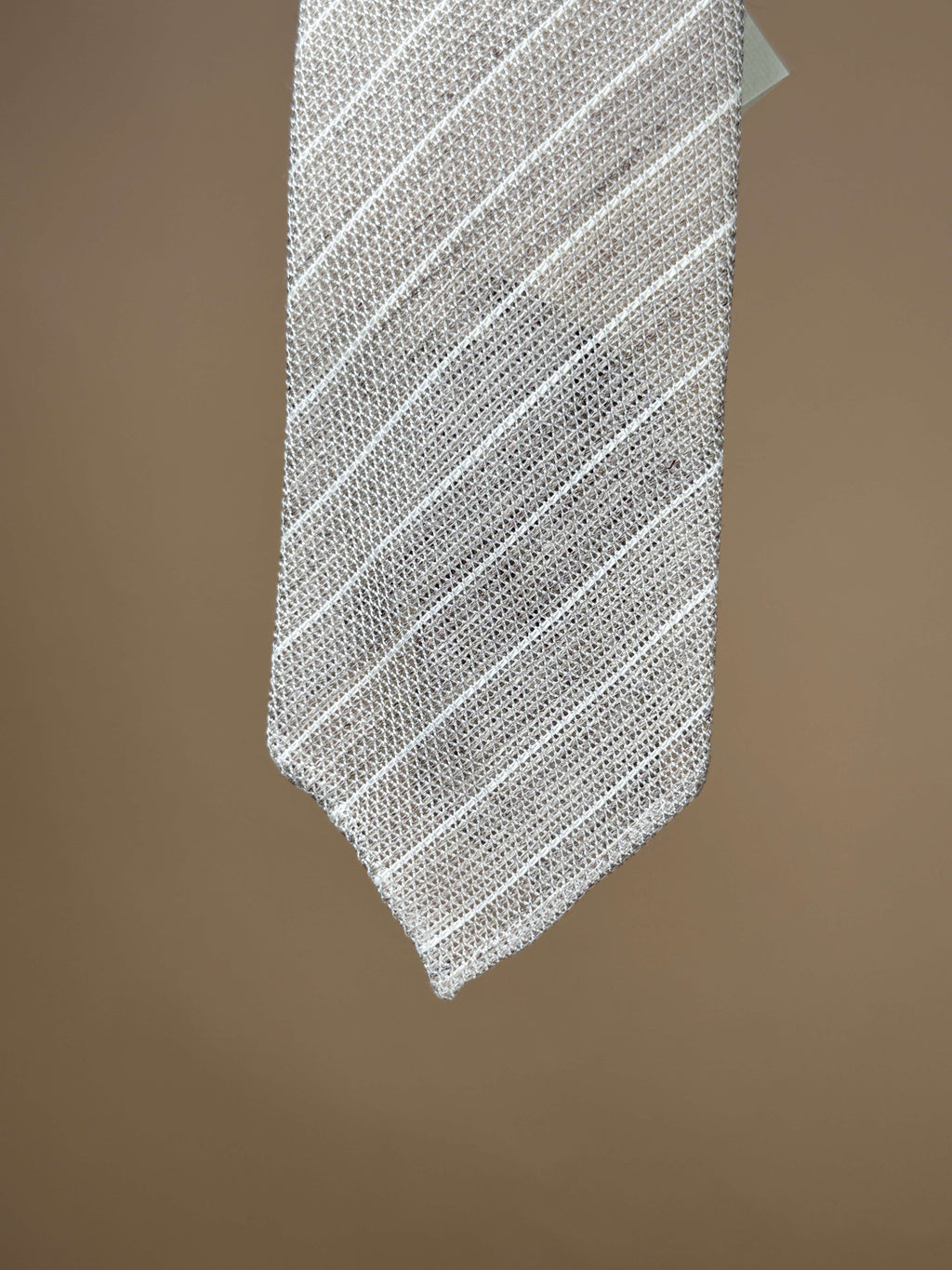 Beige knitted silk untipped tie from Paolo Albizzati, styled as a stylish accessories piece with intricate woven texture.