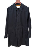 Private White V.C. Jack's Mac Raincoat in ink color, showcasing a sleek, waterproof clothing style with a classic collar and button details.