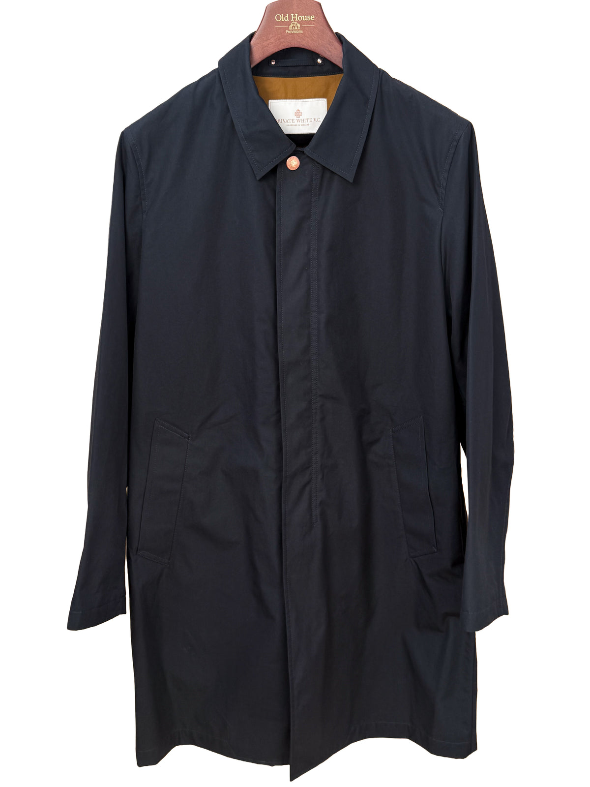 Private White V.C. Jack's Mac Raincoat in ink color, showcasing a sleek, waterproof clothing style with a classic collar and button details.