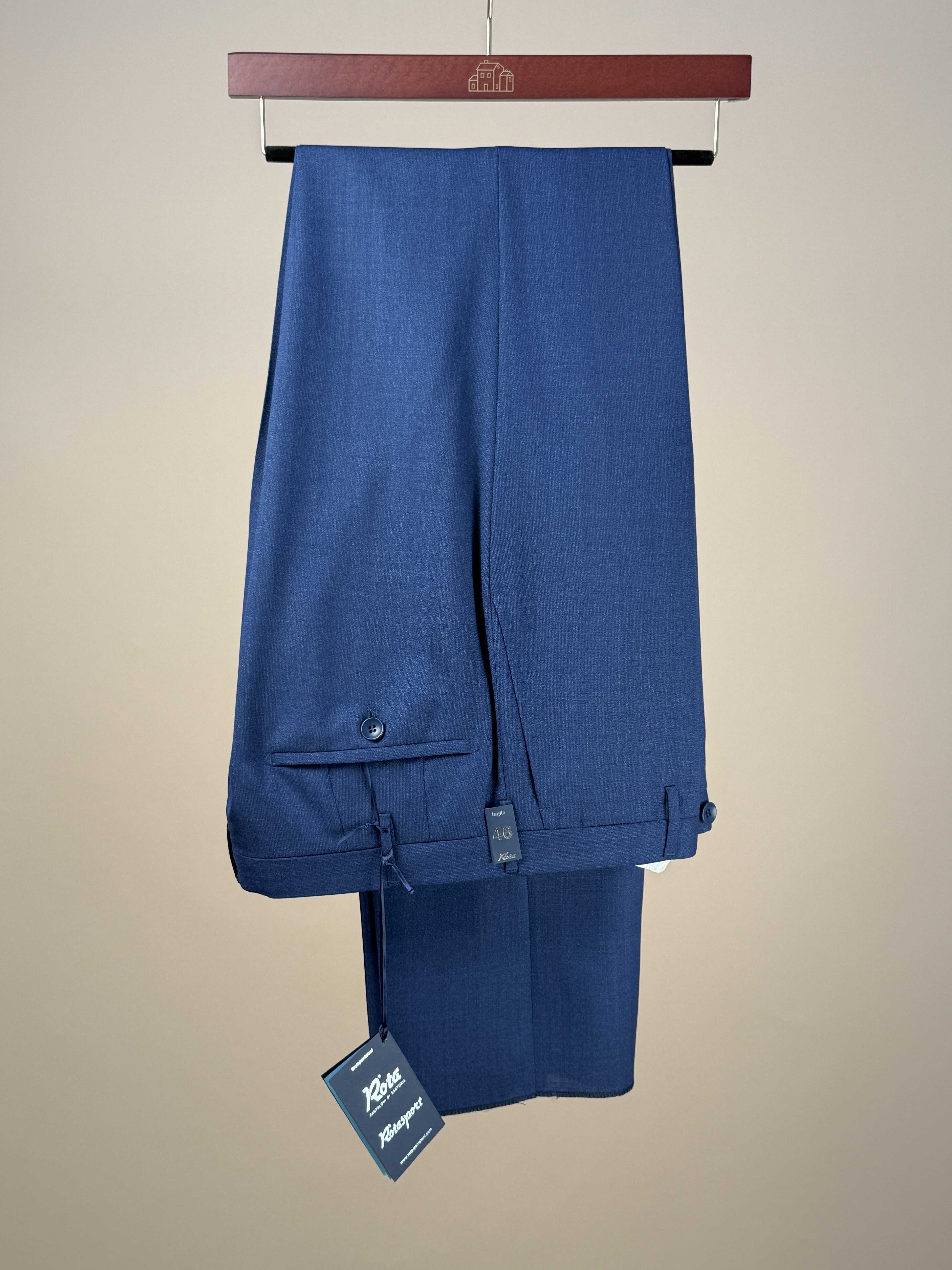Blue Rota dress trousers made from 2-ply wool, tailored fit with a classic professional style, shown on a hanger.