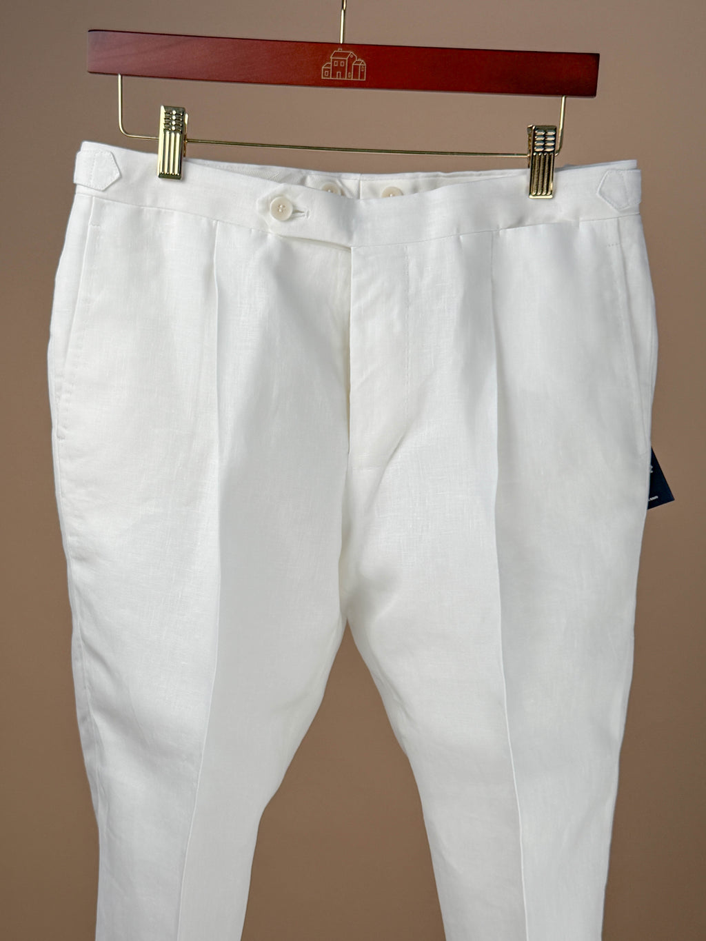 White linen pleated dress trousers by Rota, featuring a tailored fit and classic design, shown in this full-length clothing image.