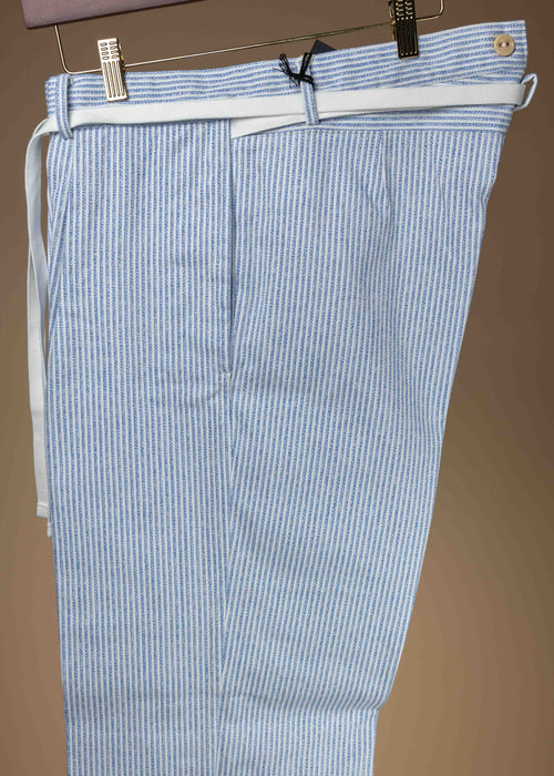Cohérence Alain blue jaspé striped twill trousers displayed on a hanger, showing the tailored fit and pattern details.