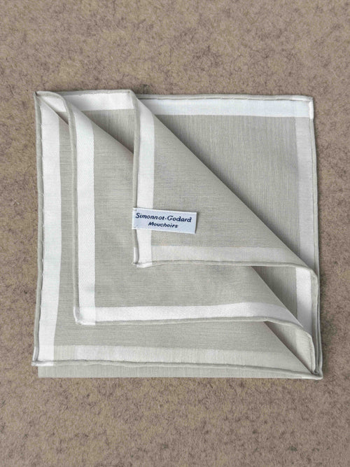 Simonnot-Godard Amalfi cotton pocket square in ivory and white, showcasing elegant accessory with classic pattern and soft fabric.