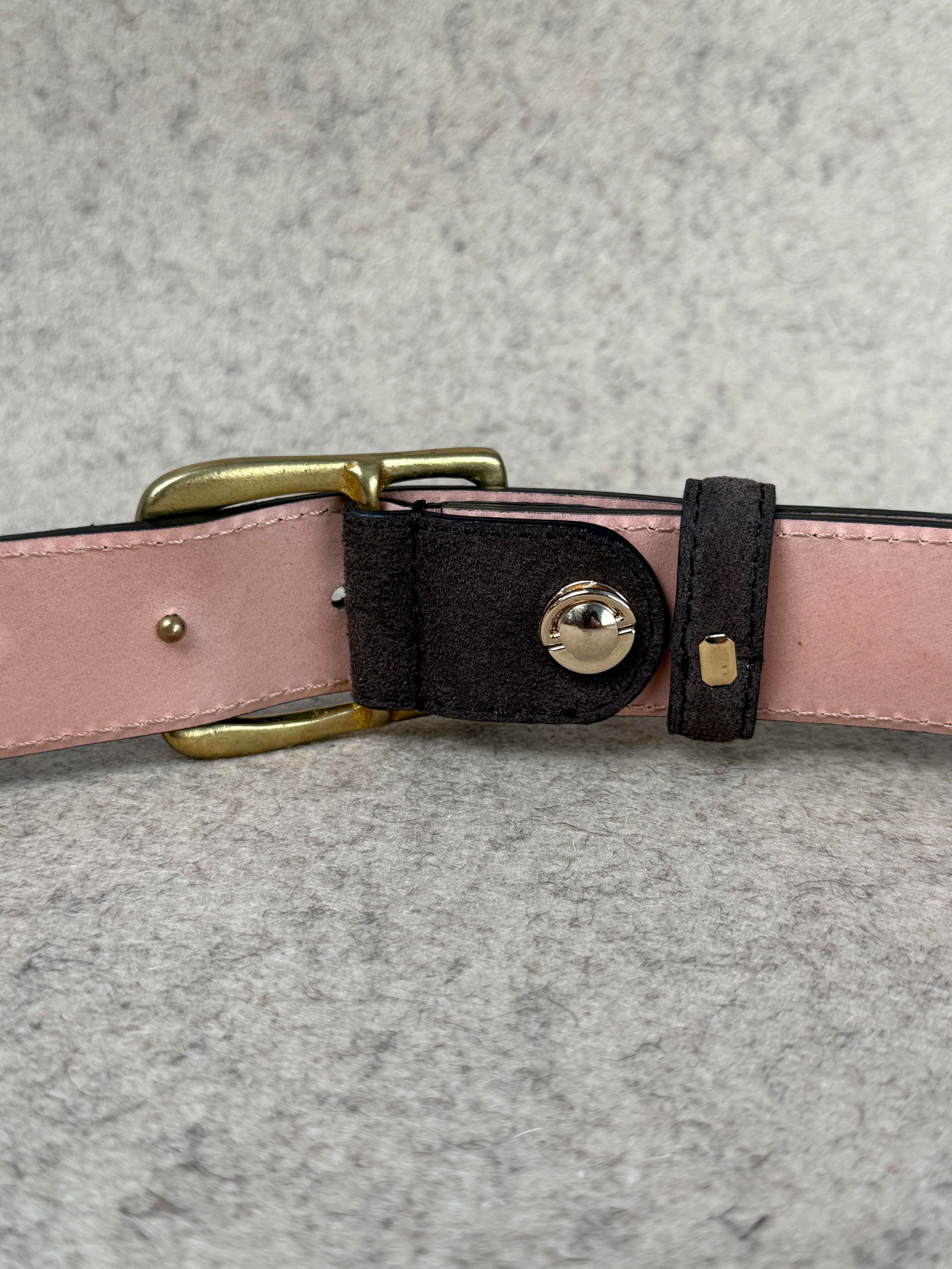 Brown suede spur belt by Simonnot-Godard, featuring detailed stitching and classic accessory style for western or casual wear.