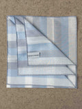 Simonnot-Godard Ravello cotton pocket square in white, sky blue, and gray with a subtle pattern, ideal for accessories.