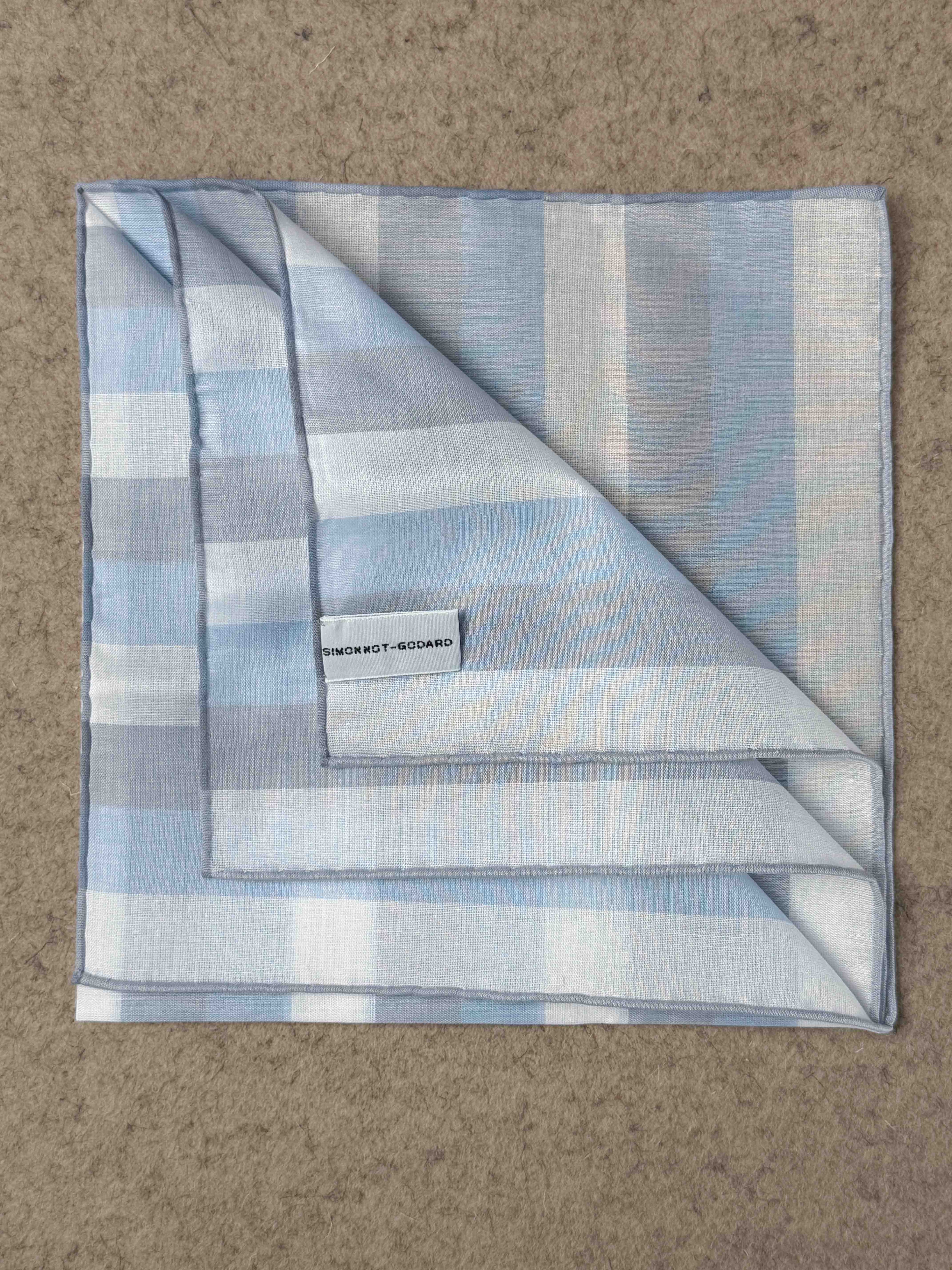 Simonnot-Godard Ravello cotton pocket square in white, sky blue, and gray with a subtle pattern, ideal for accessories.