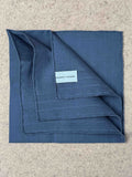 Denim blue Vicq cotton linen pocket square by Simonnot-Godard, neatly folded for accessories styling.