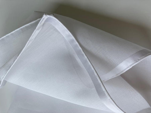 White Amalfi cotton pocket square by Simonnot-Godard, featuring a classic fold and elegant accessory design.