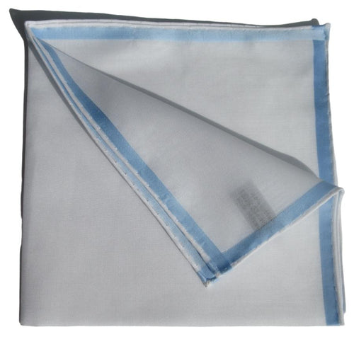 White and sky blue Amalfi cotton pocket square from Simonnot-Godard, featuring elegant folds and classic accessory style.