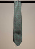 Green silk motif sevenfold tie from TieYourTie, showcasing intricate design and elegant accessory for formal wear.