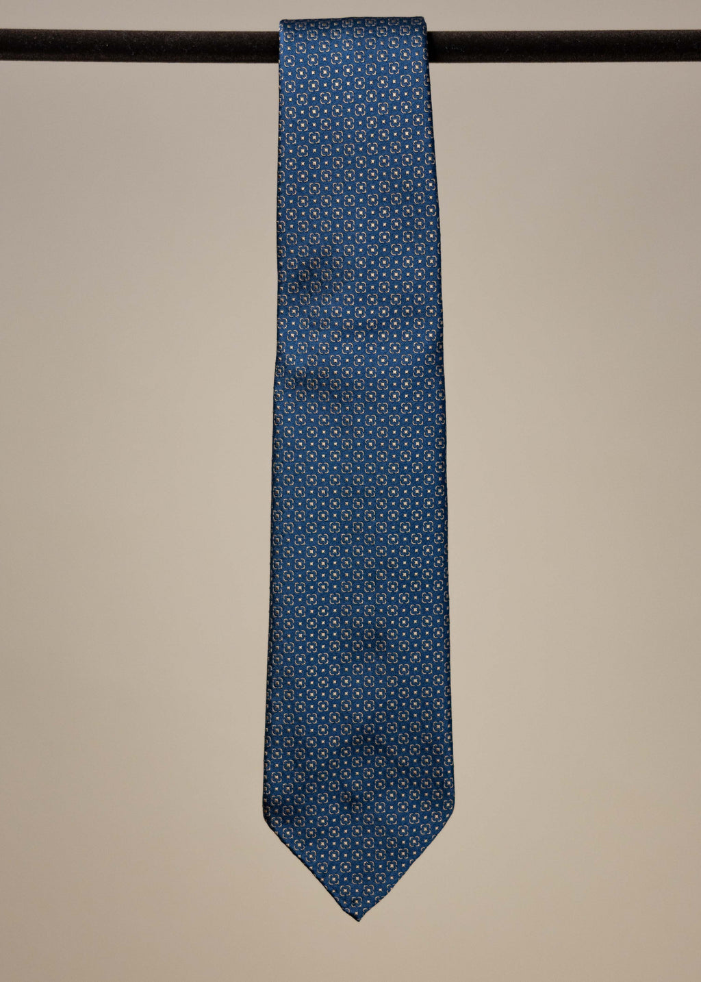 Navy and gold silk jacquard tie from TieYourTie, showcasing intricate pattern and elegant accessory design.