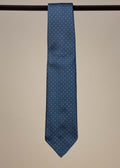 Navy and gold silk jacquard tie from TieYourTie, showcasing intricate pattern and elegant accessory design.