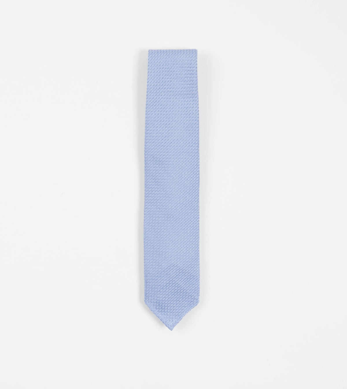 Sky blue large knot Grenadine handrolled tie by Drake's, showcasing its textured fabric and elegant knot design.
