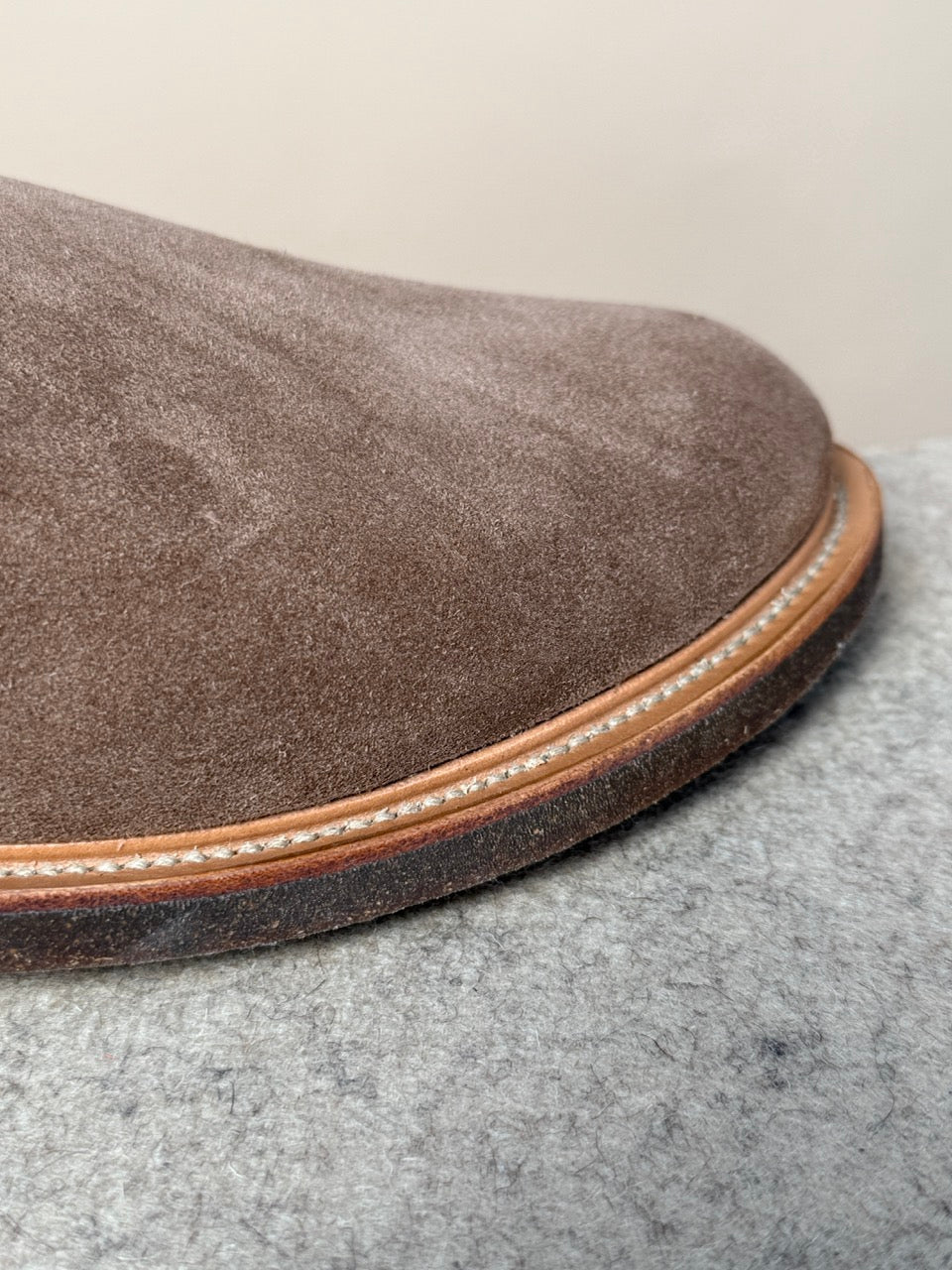 Viberg Bison Janus calf suede slipper showing a cozy, stylish footwear design with detailed stitching and soft suede material.