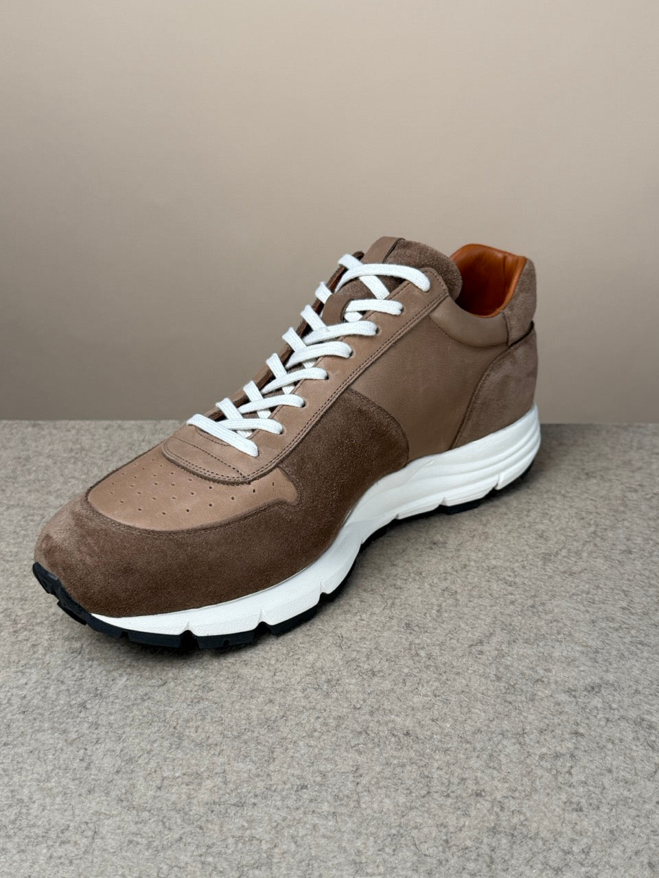 Viberg Bison Janus calf suede sneaker showcasing sleek design and premium suede material with a modern athletic look.