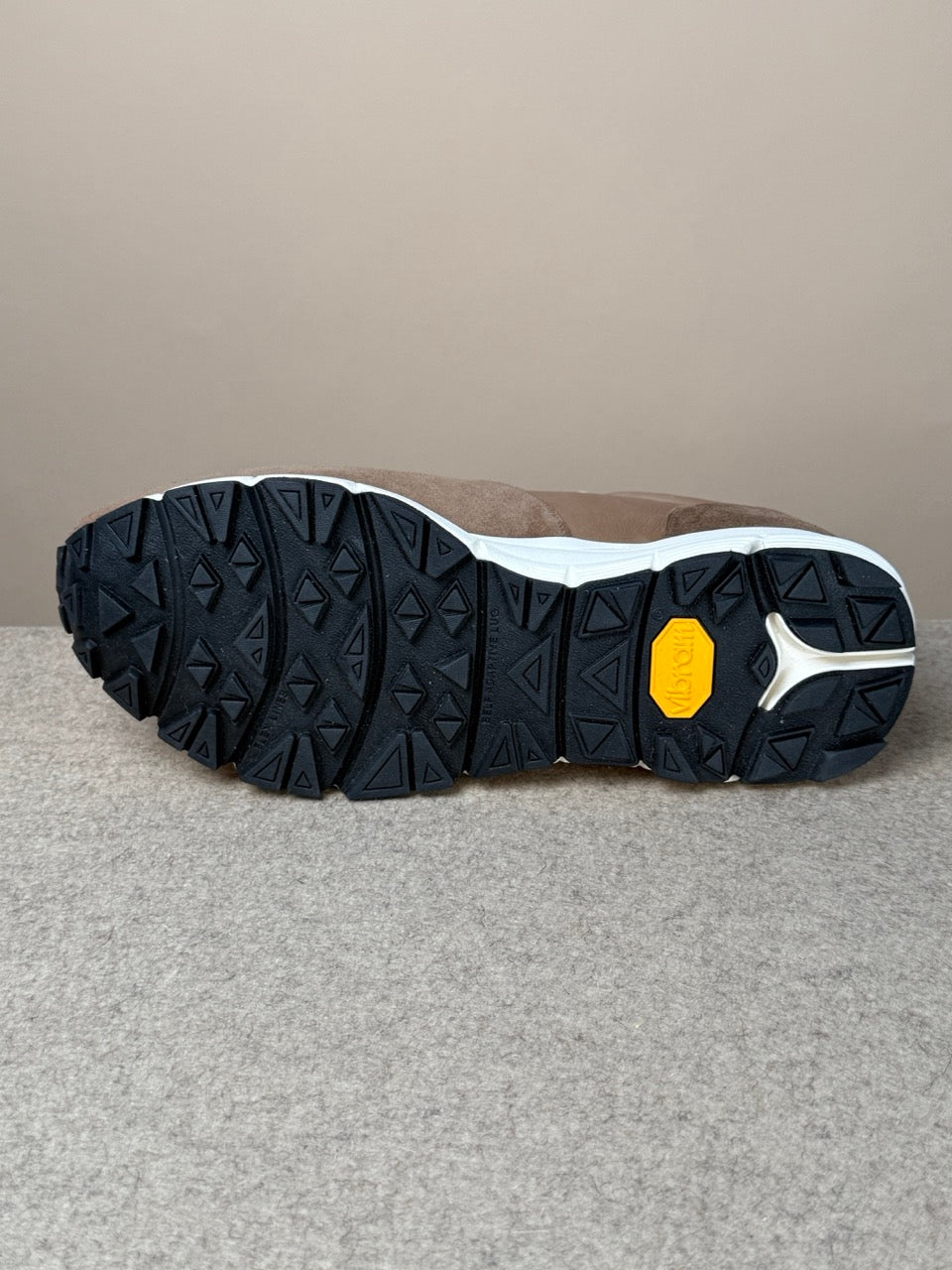 Viberg Bison Janus calf suede sneaker showing brown leather upper, white rubber sole, and detailed stitching on a white background.