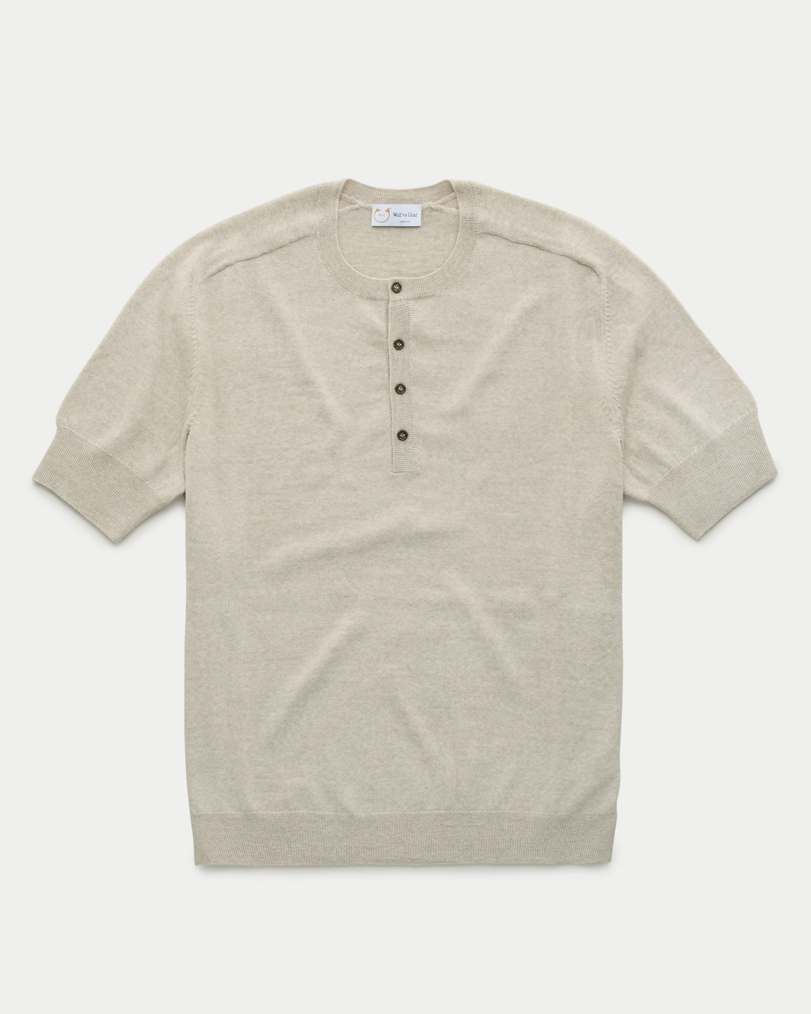 Beige wool knitted Henley shirt by Wolf vs Goat, featuring a cozy, textured knit and classic button neckline for men's casual wear.